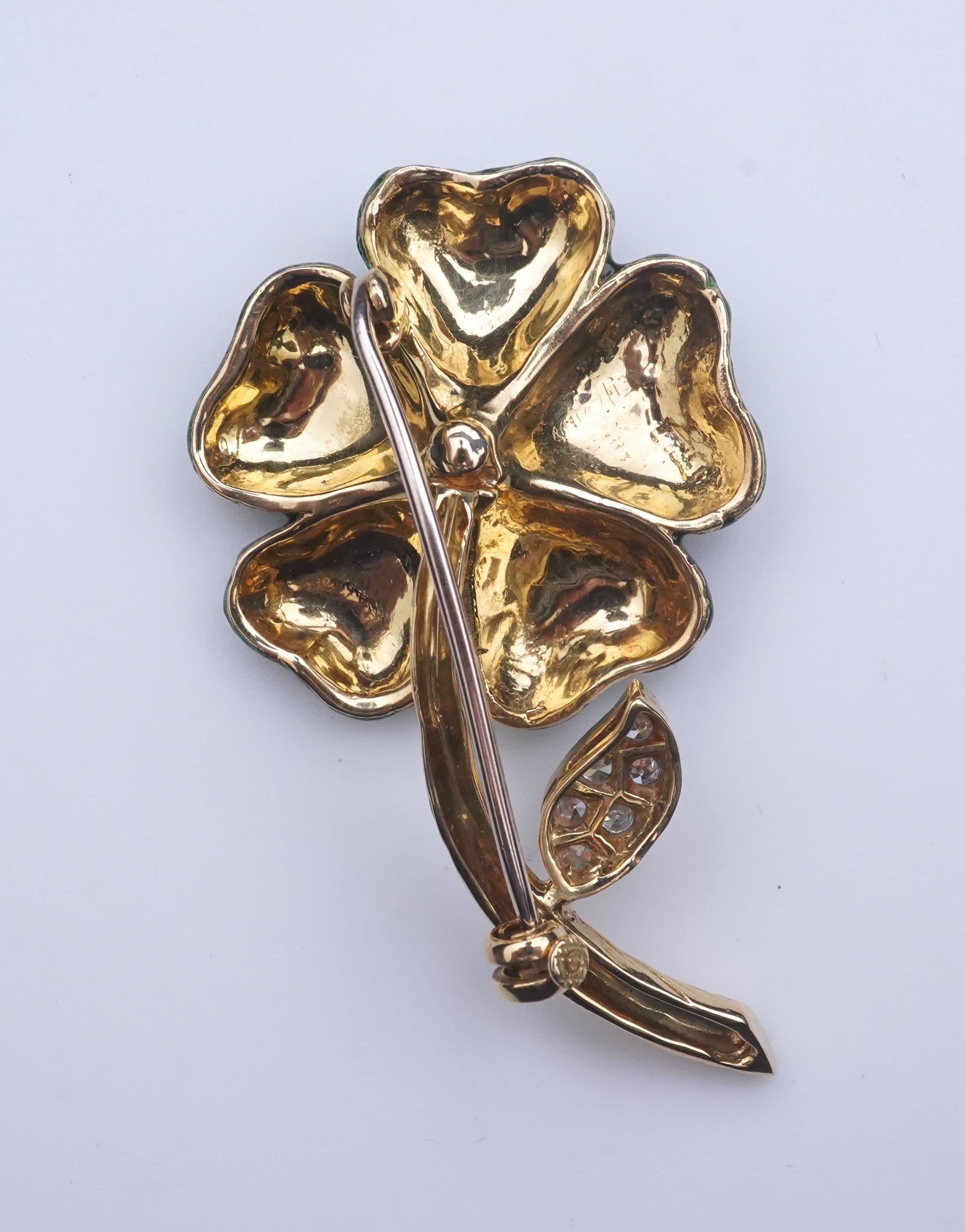 An enamel and diamond brooch